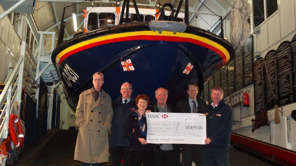 Martin Rudwick, Coxswain, being presented with the cheque